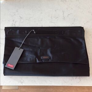 Tumi Black medium flat folding pack Sleek Minimalist Design